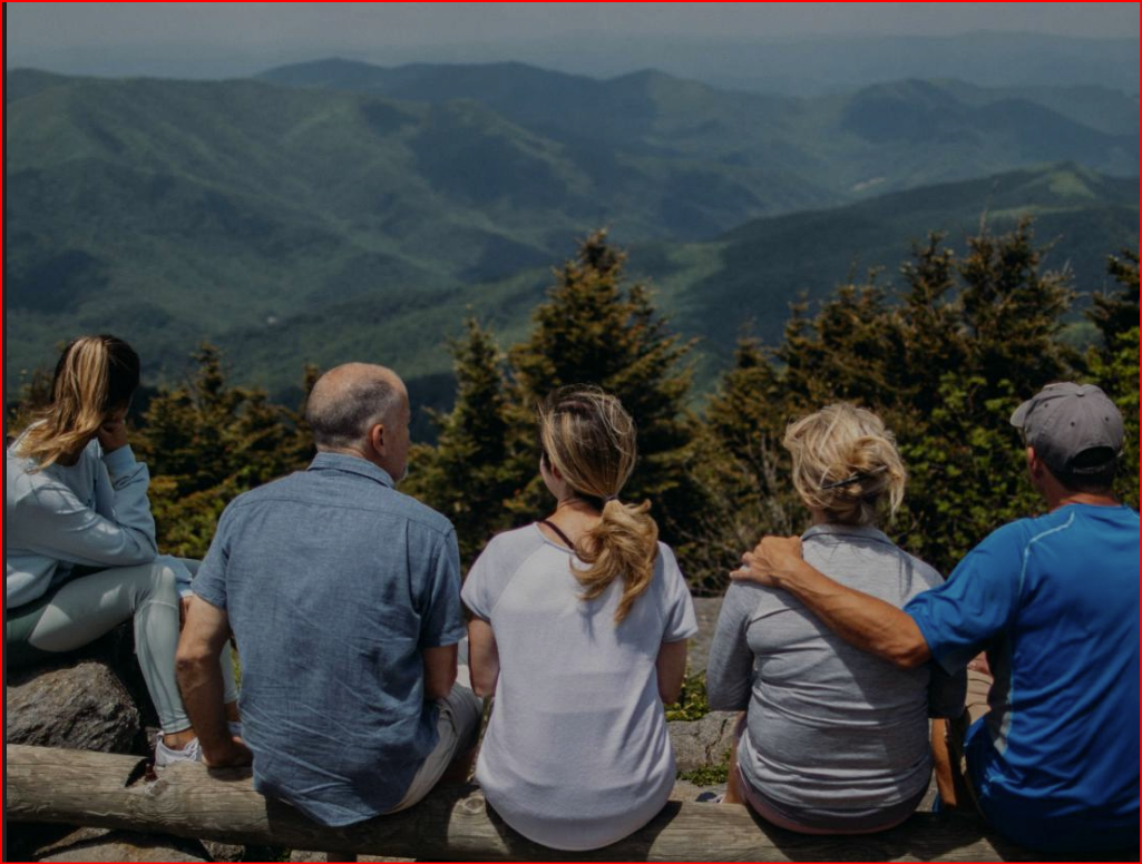 Family enjoying a mountain view together
